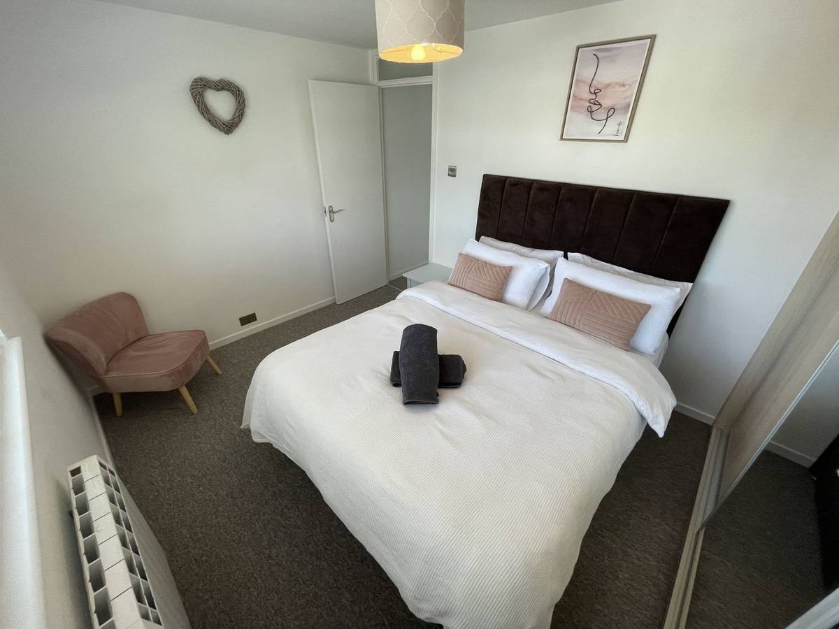 King-size bed with fresh white linen